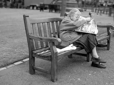 Old lady and newspaper, East Princes Street Gardens, Edinburgh