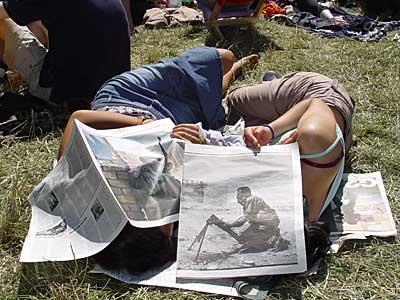 Under the newspaper, The Glade, Glastonbury Festival, June 2004