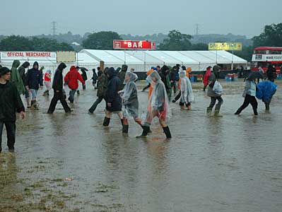 Fording the river by the Other Stage, Glastonbury Festival, Pilton, Somerset, England June 2005