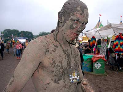 Very muddy bloke, Glastonbury Festival, Pilton, Somerset, England June 2005