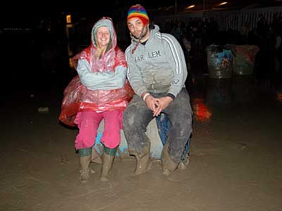 Sitting in the mud, Glastonbury Festival, Pilton, Somerset, England June 2005