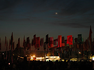 Flags against a darkening sky, Jazz World, Glastonbury Festival, Pilton, Somerset, England June 2005