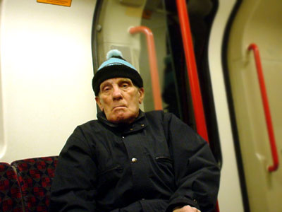 Old guy and hat, Central Line tube train, London
