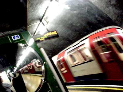 Tube train and mirror, Shepherd Bush station London