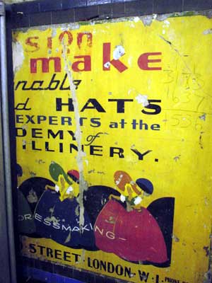 Old advertisement, Tottenham Court Road tube station, London