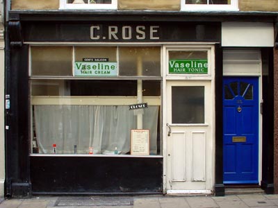 Old barber's shop, Whitcomb Street, London: October 2002