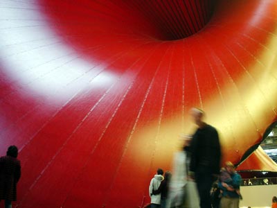 People and red sculpture, Turbine Hall, Tate Modern, London: October 2002