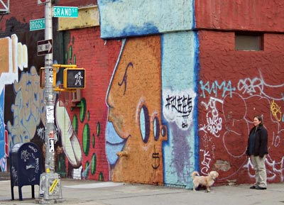 Woman with small dog, Driggs Avenue and Grand Street, Williamsburg, Brooklyn, New York, Brooklyn, New York, NYC, US