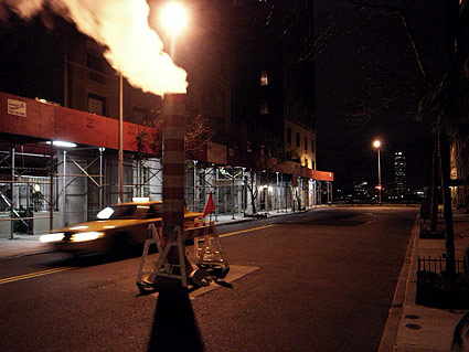 Steam and passing cab, upper east side. Night photographs on the streets of New York, NYC, December 2006