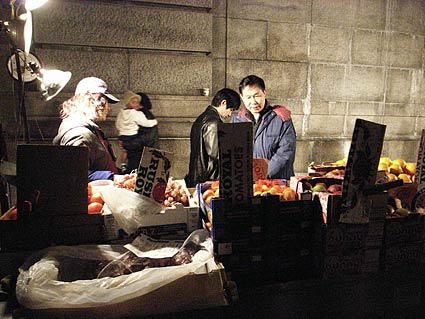 Street market, Chinatown, East Broadway. Night photographs on the streets of New York, NYC, December 2006