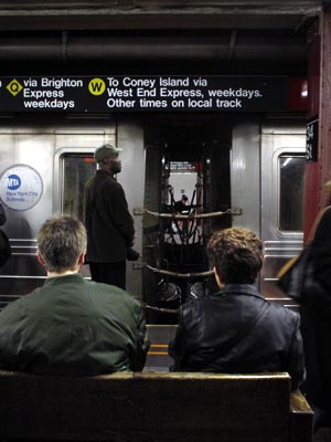 Waiting for the downtown train, 34th Street subway, Manhattan, New York