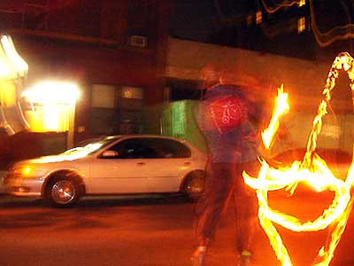 Fire juggler, Halloween Parade, 6th Avenue, Manhattan, New York, NYC, USA
