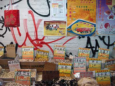 Shop stall and graffiti, Chinatown, Manhattan, New York, NYC, USA