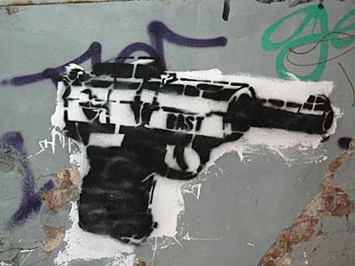 Gun stencil graffiti, off Bedford Avenue, Williamsburg, New York City, NYC, USA