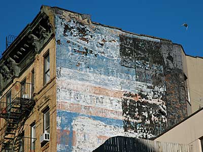 Faded street advert, Clinton Street, Lower East Side, Manhattan, New York, NYC, USA