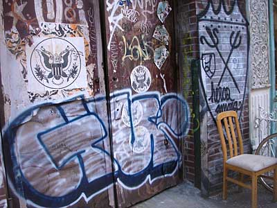 Graffiti shield and chair, SoHo, New York, signs, shops and graffiti, Manhattan, New York, USA