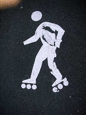 Roller skate pavement sign, Manhattan NYC, USA