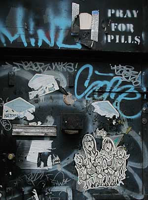 Pray for Pills and black door, Little Italy, Manhattan NYC, USA