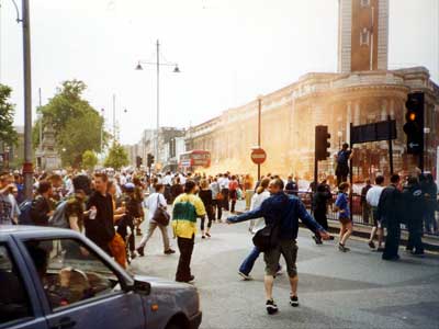 Crowds assemble, Reclaim the Streets, Brixton High Road, June 1998 