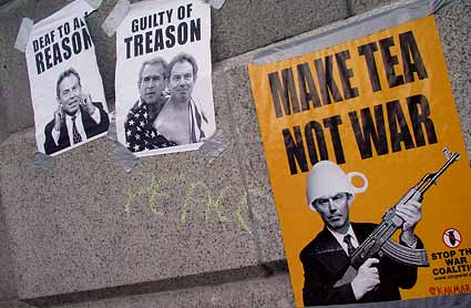 Anti Bush/Blair posters on steps around Trafalgar Square
