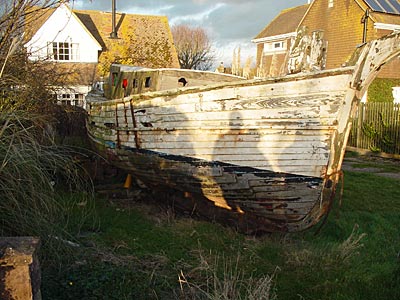 Boat on the lawn, Camber Sands, Rye, Sussex, UK