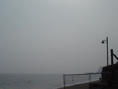 Sea, mist and lamp, Teignmouth, Devon, March 2003