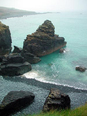 Rocks and turquoise sea, near Clodgy Point, St Ives, Cornwall, March 2003