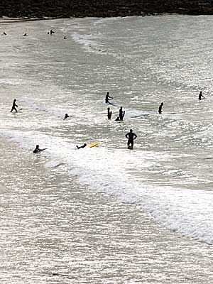 Surfers, Porthmeor Beach, St Ives, Cornwall, April 2004