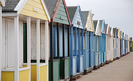 Southwold beach huts, photos of the brightly coloured beach hits on the beach at Southwold, Suffolk, East Anglia, England, UK