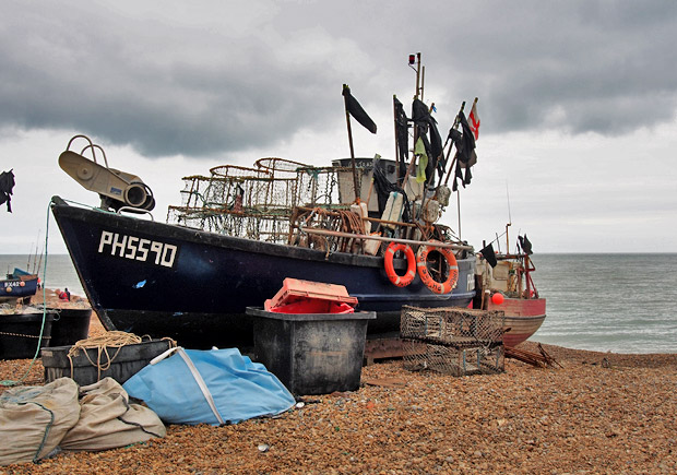 Fishermans boats on the Stade beach, Hastings seafront, Hastings, East Sussex, England UK July 2012