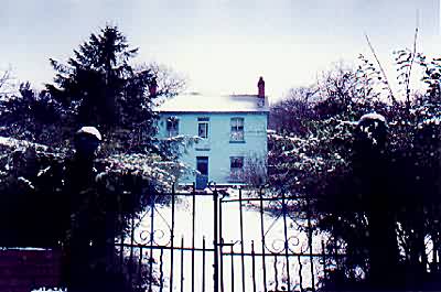 blue house on the hill 

