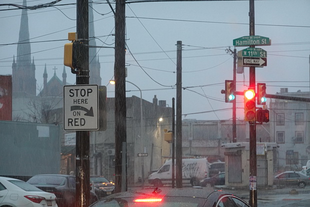 On tour in America: signs, street lights, wires and stop signs