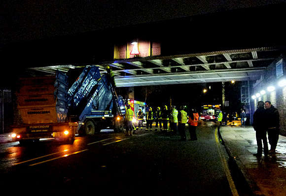 Bam! Skip lorry smashes into rail bridge on Barrington Road, Brixton