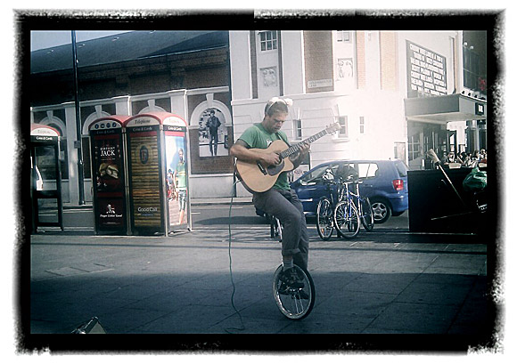 Brixton photos: unicycling busker, architecture and coffee
