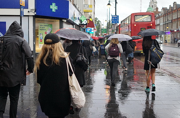 Umbrellas in June: a very rainy day in central London and Brixton