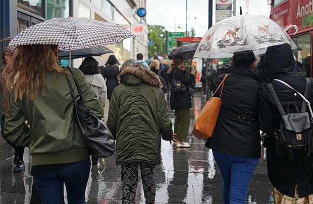 Umbrellas in June: a very rainy day in central London and Brixton
