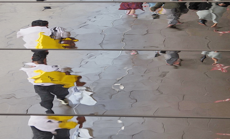 Oxford Street Reflections - abstract human shapes on a mirrored roof