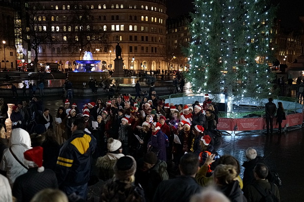 Choirs sing traditional Christmas carols in Trafalgar Square, London, December 2015