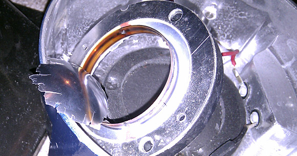 Now *that's* a blown speaker! RIP Turbosound