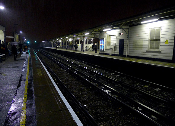 Wandsworth Town station in the early evening rain