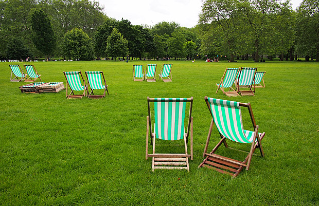 Empty deckchairs and a damp June afternoon in Green Park, London
