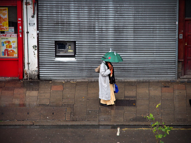 Happy brolly, sad weather - Brixton in the summer rain