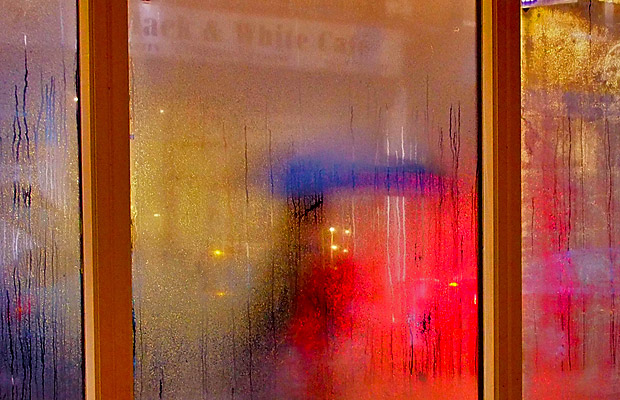 Strangers passing by in the rain, Brixton