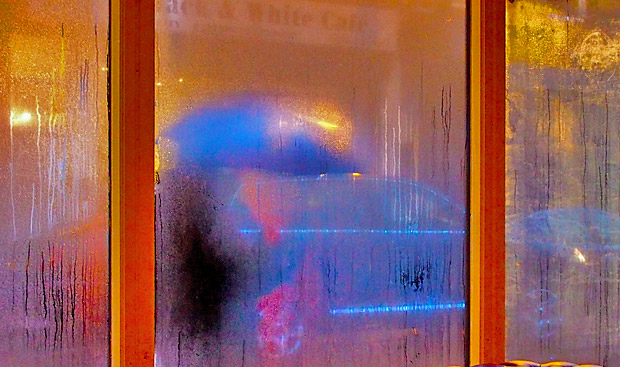 Strangers passing by in the rain, Brixton