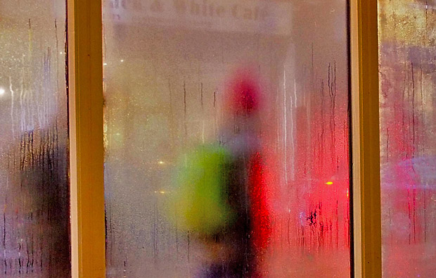 Strangers passing by in the rain, Brixton