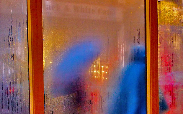Strangers passing by in the rain, Brixton