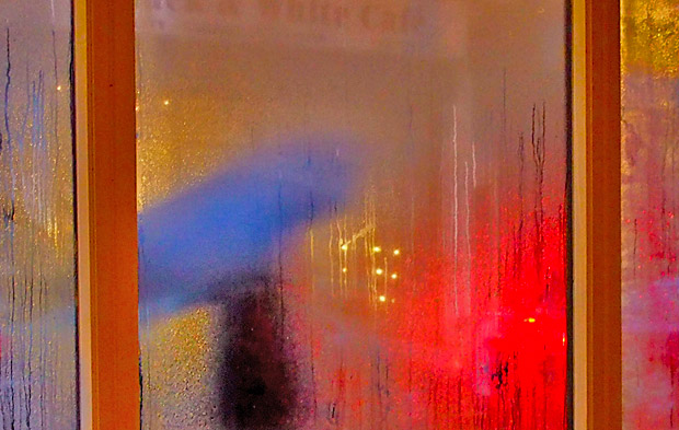 Strangers passing by in the rain, Brixton