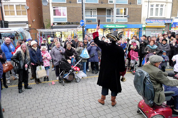 Christmas lights get turned on at Roman Road, east London., Mrs Mills Experience play live