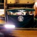 Tax-shirking Starbucks extend their branding onto Brixton flower stall