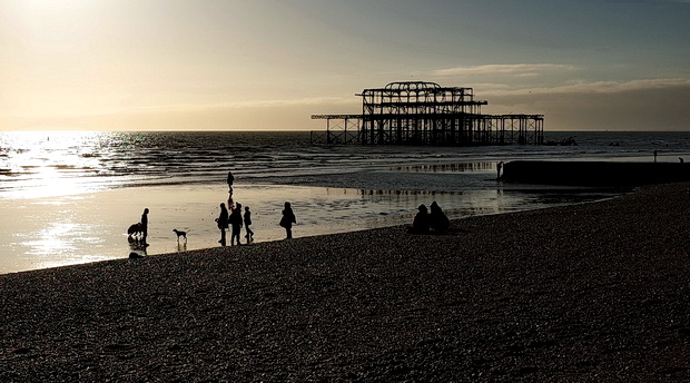 Brighton's derelict West Pier in the winter sun and storms - in photos